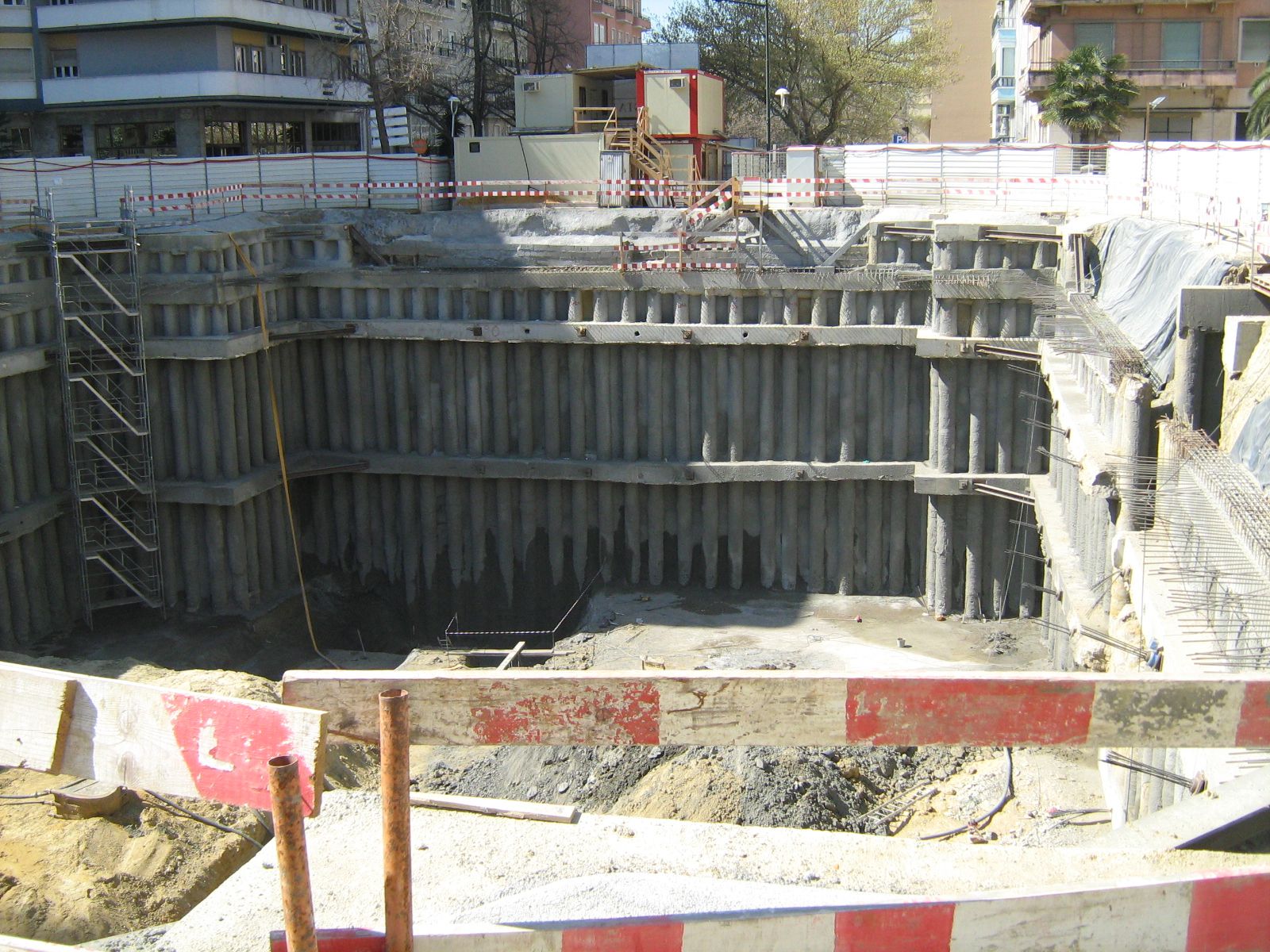 A bored-pile retaining wall under construction, an engineered wall type used on difficult sites